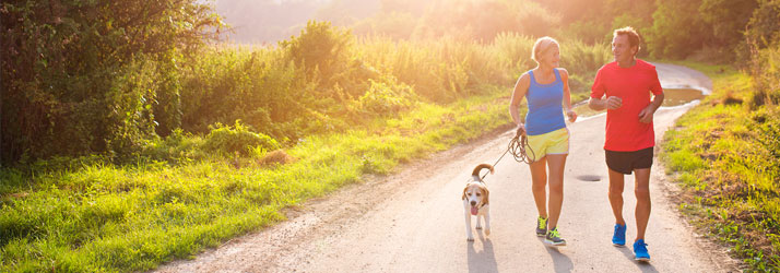 Couple Jogging with Dog